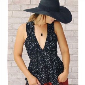 Black With White Polka Dots Sleeveless Blouse